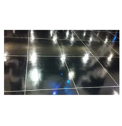 Black dance floor of glossy square panels with thin white seams, reflecting overhead lights